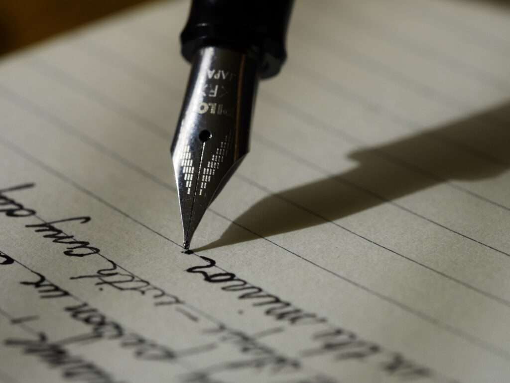 my writing process newsletter article old fashioned pen on lined paper