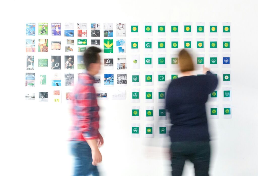 two blurry people looking at a wall with multiple images on it.

nonprofit brand clarity