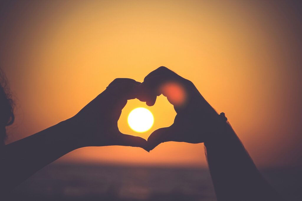 two hands making a heard with the sun in the middle.

donor stewardship brand experience
