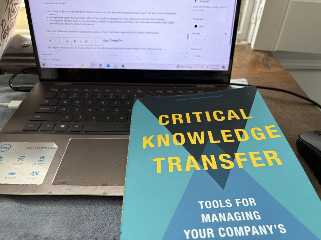 Critical Knowledge Transfer: Tools for Managing Your Company’s Deep Smarts by Dorothy Leonard, Walter Swap, and Gavin Barton sitting on an open laptop,