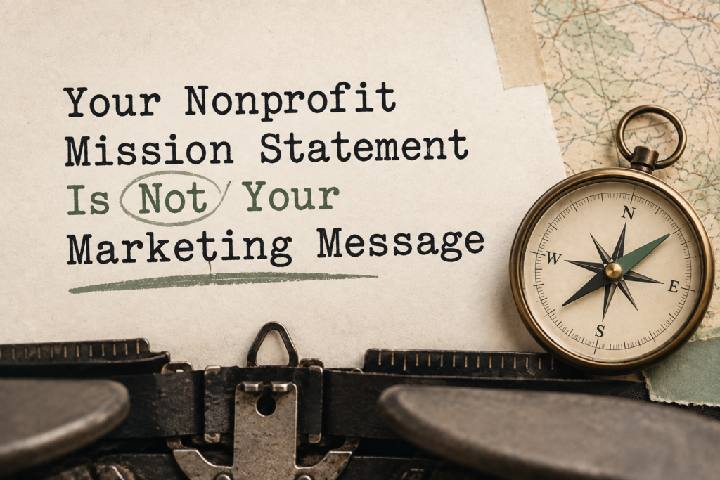 Vintage typewriter page reading “Your Nonprofit Mission Statement Is Not Your Marketing Message,” alongside a brass compass.